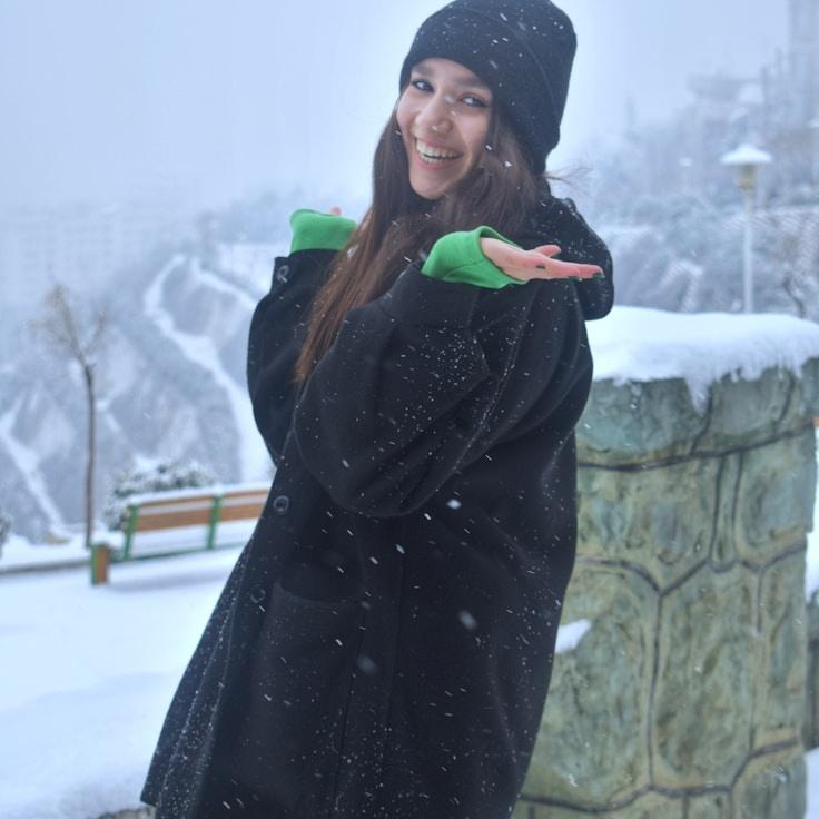 Ananya Gupta, Lead Design Curator at SkyGemNet, reviewing corporate floral arrangements